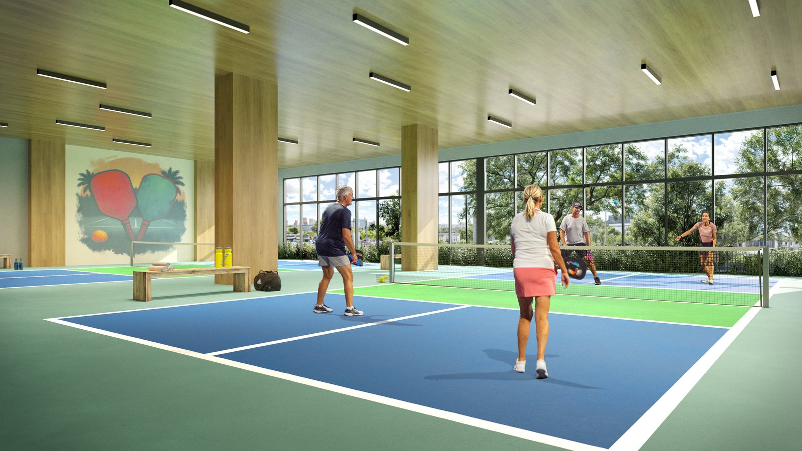 Covered pickleball courts within the amenity level, from the project renderings.