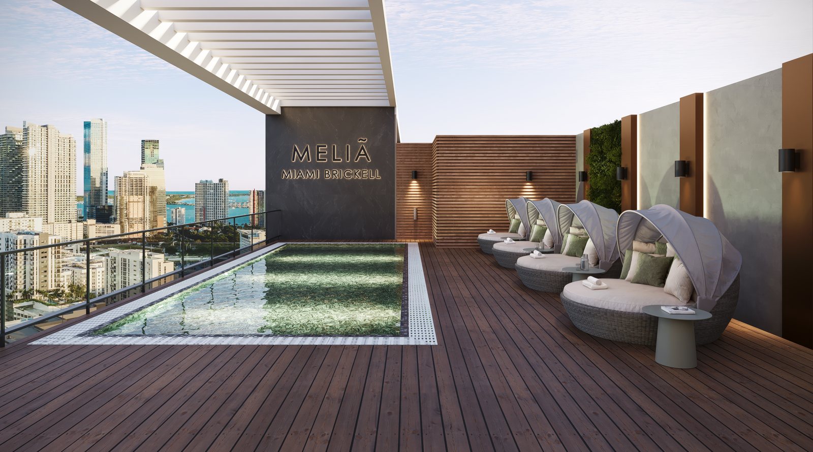 Rooftop pool terrace with the Brickell skyline beyond, from the approved brochure. Rendering is conceptual.